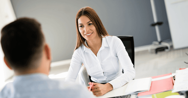 A person smiling in a office