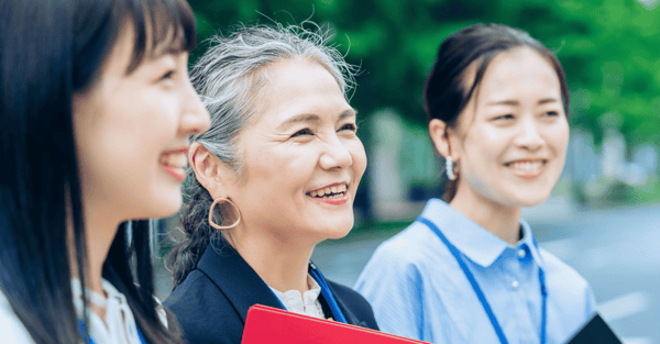 Three women smiling